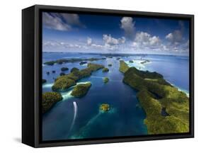 An Aerial View of a Boat as it Speeds Through the Rock Islands, Republic of Palau.-Ian Shive-Framed Stretched Canvas
