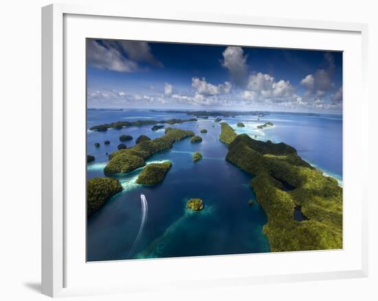 An Aerial View of a Boat as it Speeds Through the Rock Islands, Republic of Palau.-Ian Shive-Framed Photographic Print