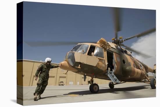 An Afghan Air Force Aerial Gunner Makes Final Checks on a Mi-17 Helicopter-null-Stretched Canvas