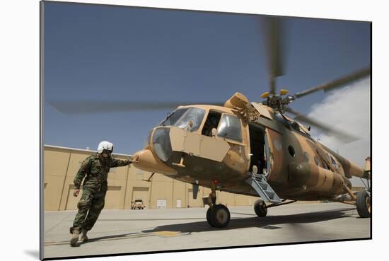 An Afghan Air Force Aerial Gunner Makes Final Checks on a Mi-17 Helicopter-null-Mounted Photographic Print