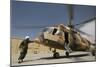 An Afghan Air Force Aerial Gunner Makes Final Checks on a Mi-17 Helicopter-null-Mounted Photographic Print