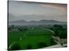 An Afghan Man Rides His Bicycle on a Dirt Road on the Northern Edge of Kabul, Afghanistan-David Guttenfelder-Stretched Canvas