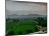 An Afghan Man Rides His Bicycle on a Dirt Road on the Northern Edge of Kabul, Afghanistan-David Guttenfelder-Mounted Premium Photographic Print