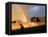 An Afghan Man Walks Past Destroyed Buildings Occupied by Refugees after a Heavy Rain-null-Framed Stretched Canvas