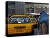 An Afghan Woman Clad in a Burqa Walks Next to a Taxi in Kabul, Afghanistan, Wednesday, June 7, 2006-Rodrigo Abd-Stretched Canvas