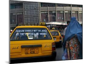 An Afghan Woman Clad in a Burqa Walks Next to a Taxi in Kabul, Afghanistan, Wednesday, June 7, 2006-Rodrigo Abd-Mounted Photographic Print
