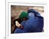 An Afghan Woman Holding Her Child Throws Back Her Burqa to See Her Way Along a Muddy Alley-null-Framed Photographic Print