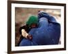 An Afghan Woman Holding Her Child Throws Back Her Burqa to See Her Way Along a Muddy Alley-null-Framed Photographic Print