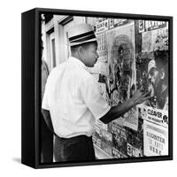 An African American Pokes His Finger into a Bullet Hole in the Oakland Black Panther's Headquarters-null-Framed Stretched Canvas