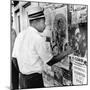 An African American Pokes His Finger into a Bullet Hole in the Oakland Black Panther's Headquarters-null-Mounted Photo