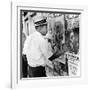 An African American Pokes His Finger into a Bullet Hole in the Oakland Black Panther's Headquarters-null-Framed Photo