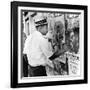 An African American Pokes His Finger into a Bullet Hole in the Oakland Black Panther's Headquarters-null-Framed Photo