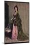 'An afternoon dress of green and pink silk. Very typical of the modes between 1868 and 1878', c1913-Unknown-Mounted Photographic Print