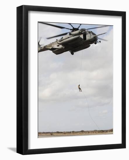 An Air Force Pararescueman Conducts a Combat Insertion and Extraction Exercise in Djibouti, Africa-null-Framed Photographic Print