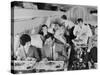 An Airline Steward and Air Hostess Serve a Roast Meal to Flight Passengers-null-Stretched Canvas