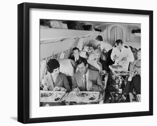 An Airline Steward and Air Hostess Serve a Roast Meal to Flight Passengers-null-Framed Photographic Print