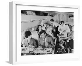 An Airline Steward and Air Hostess Serve a Roast Meal to Flight Passengers-null-Framed Photographic Print