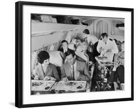 An Airline Steward and Air Hostess Serve a Roast Meal to Flight Passengers-null-Framed Photographic Print