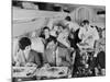 An Airline Steward and Air Hostess Serve a Roast Meal to Flight Passengers-null-Mounted Photographic Print