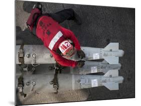 An Airman Moves Ordnance On the Flight Deck of the Aircraft Carrier USS Carl Vinson-Stocktrek Images-Mounted Photographic Print