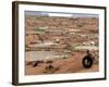 An Albanian Resident of Kukes Scavenges a Leftover Tractor Tire from a Vacant Refugee Camp-null-Framed Photographic Print