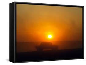 An American Humvee Drives Through the Desert at Sunset Near the Iraqi Border-null-Framed Stretched Canvas