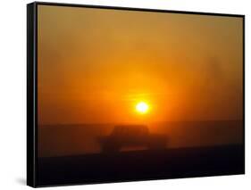 An American Humvee Drives Through the Desert at Sunset Near the Iraqi Border-null-Framed Stretched Canvas