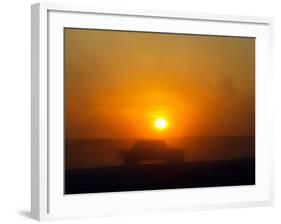 An American Humvee Drives Through the Desert at Sunset Near the Iraqi Border-null-Framed Photographic Print