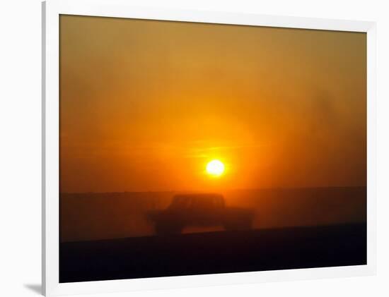 An American Humvee Drives Through the Desert at Sunset Near the Iraqi Border-null-Framed Photographic Print