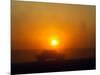 An American Humvee Drives Through the Desert at Sunset Near the Iraqi Border-null-Mounted Photographic Print