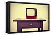 An Ancient Red Television on a Table with a Retro Effect-nito-Framed Stretched Canvas