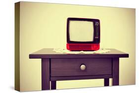 An Ancient Red Television on a Table with a Retro Effect-nito-Stretched Canvas