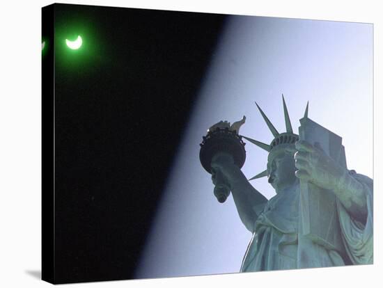 An Annular Eclipse Passes Above the Statue of Liberty-null-Stretched Canvas