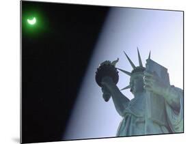 An Annular Eclipse Passes Above the Statue of Liberty-null-Mounted Photographic Print