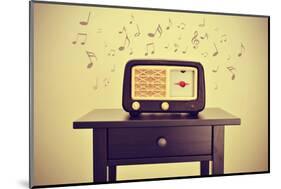 An Antique Radio Receptor on a Desk and Musical Notes, with a Retro Effect-nito-Mounted Photographic Print