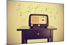 An Antique Radio Receptor on a Desk and Musical Notes, with a Retro Effect-nito-Mounted Photographic Print