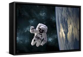 An Astronaut Floating Above Earth-Stocktrek Images-Framed Stretched Canvas