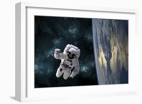 An Astronaut Floating Above Earth-Stocktrek Images-Framed Photographic Print