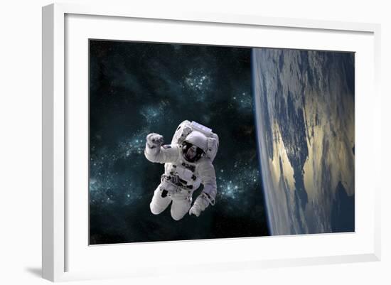 An Astronaut Floating Above Earth-Stocktrek Images-Framed Photographic Print