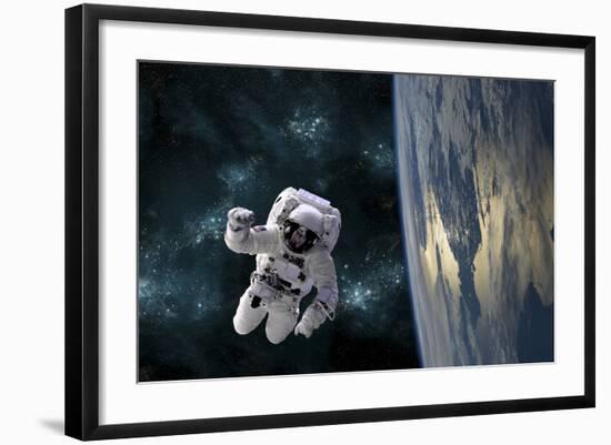 An Astronaut Floating Above Earth-Stocktrek Images-Framed Photographic Print