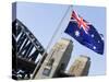 An Australian Flag Flutters in Breeze in Front of Iconic Sydney Harbour Bridge, Sydney-Andrew Watson-Stretched Canvas