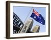 An Australian Flag Flutters in Breeze in Front of Iconic Sydney Harbour Bridge, Sydney-Andrew Watson-Framed Photographic Print