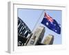 An Australian Flag Flutters in Breeze in Front of Iconic Sydney Harbour Bridge, Sydney-Andrew Watson-Framed Photographic Print