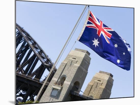 An Australian Flag Flutters in Breeze in Front of Iconic Sydney Harbour Bridge, Sydney-Andrew Watson-Mounted Photographic Print