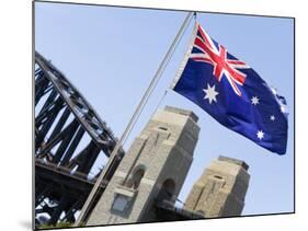 An Australian Flag Flutters in Breeze in Front of Iconic Sydney Harbour Bridge, Sydney-Andrew Watson-Mounted Photographic Print