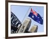 An Australian Flag Flutters in Breeze in Front of Iconic Sydney Harbour Bridge, Sydney-Andrew Watson-Framed Photographic Print