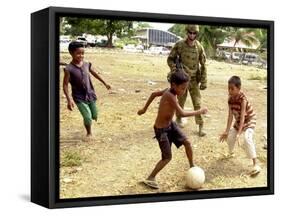 An Australian Soldier Plays with Displaced East Timorese Children-null-Framed Stretched Canvas
