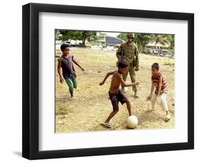 An Australian Soldier Plays with Displaced East Timorese Children-null-Framed Photographic Print