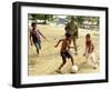 An Australian Soldier Plays with Displaced East Timorese Children-null-Framed Photographic Print