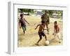 An Australian Soldier Plays with Displaced East Timorese Children-null-Framed Photographic Print